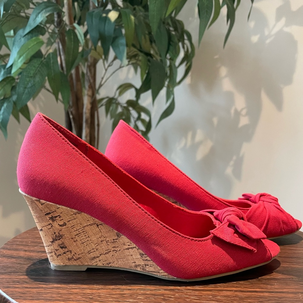 Sassy Red Cork Heel Wedges. Canvas Material. With cute bow at peek toe. Size 7.